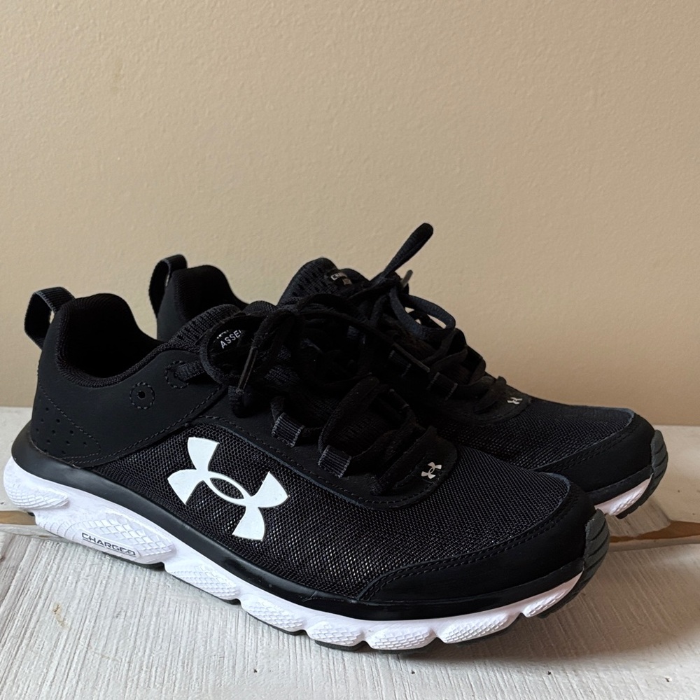 Under Armour Charged Assert Black Athletic Shoes with White Logo
